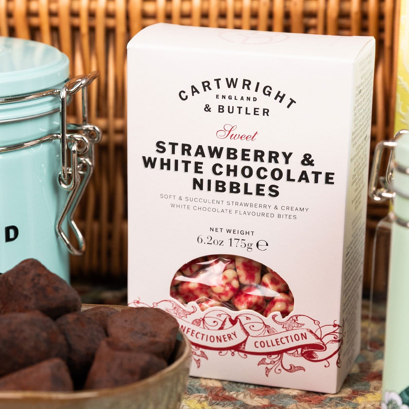 Cartwright & Butler Strawberry & White Chocolate Nibbles presented in a gift box with rich cocoa-dusted truffles and luxury pantry items.