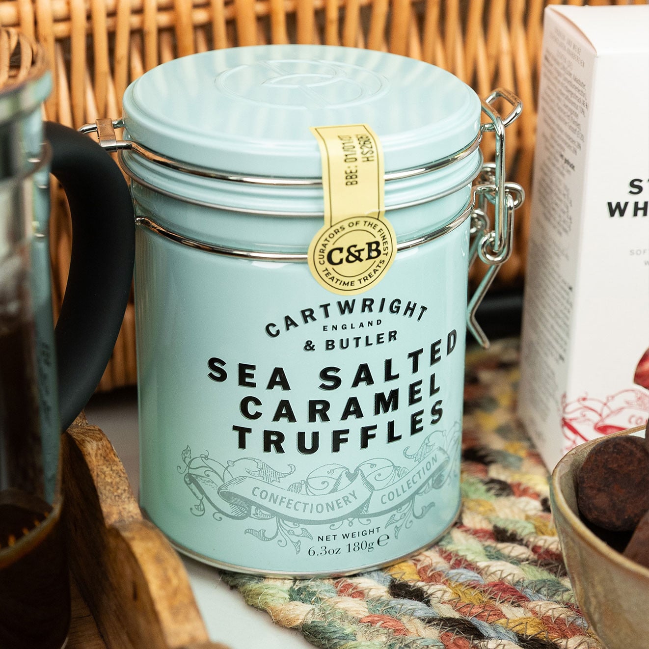Cartwright & Butler Sea Salted Caramel Truffles in a pastel blue gift tin served with buttery biscuits and gourmet sweet treats.
