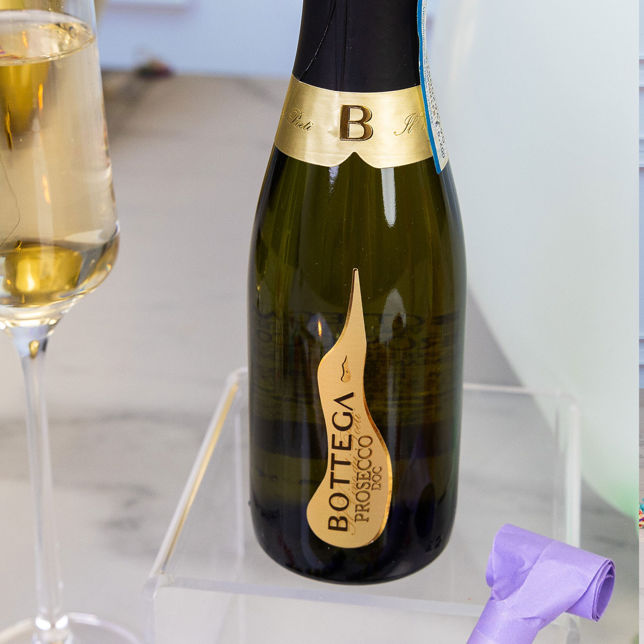 Mini bottle of Bottega Prosecco DOC presented with a filled champagne flute, perfect for birthday celebrations and luxury gifting.
