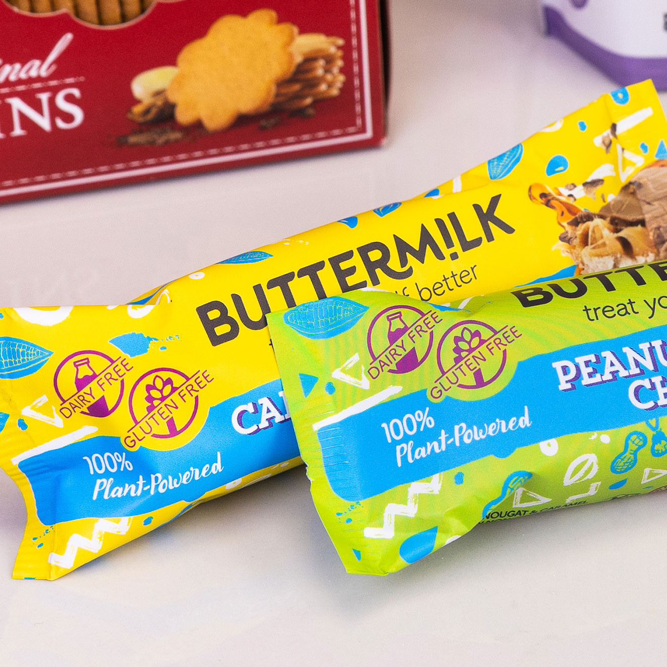 Buttermilk dairy-free, gluten-free plant-powered chocolate bars in caramel nougat and peanut choc flavours.