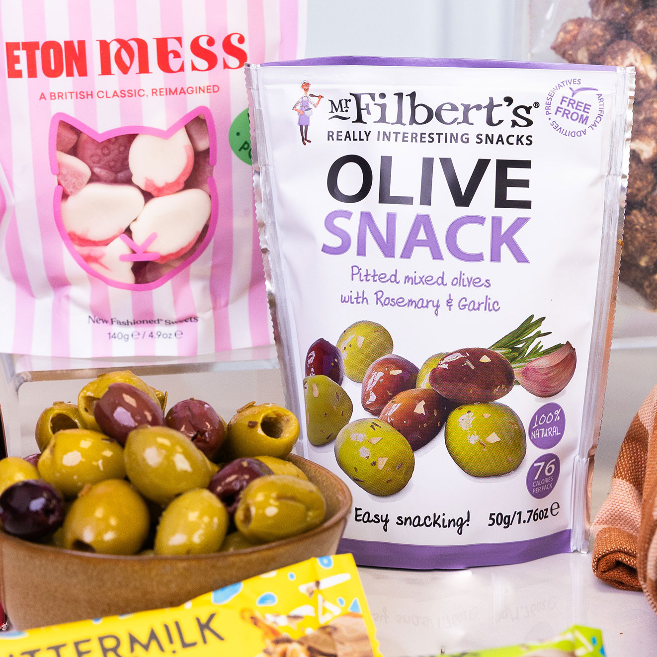 Mr Filbert's Olive Snack with rosemary and garlic, featuring pitted mixed olives for convenient savoury snacking.