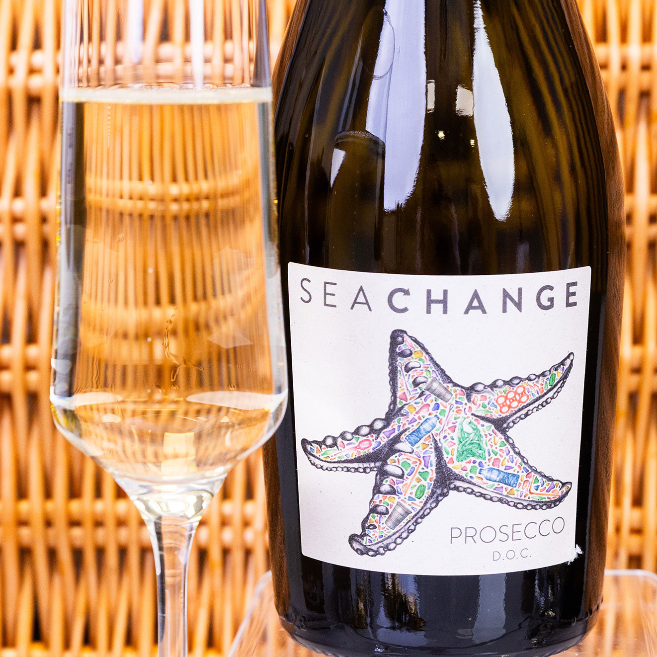 Sea Change Prosecco D.O.C. served with a filled champagne flute, ideal for celebratory gifting.