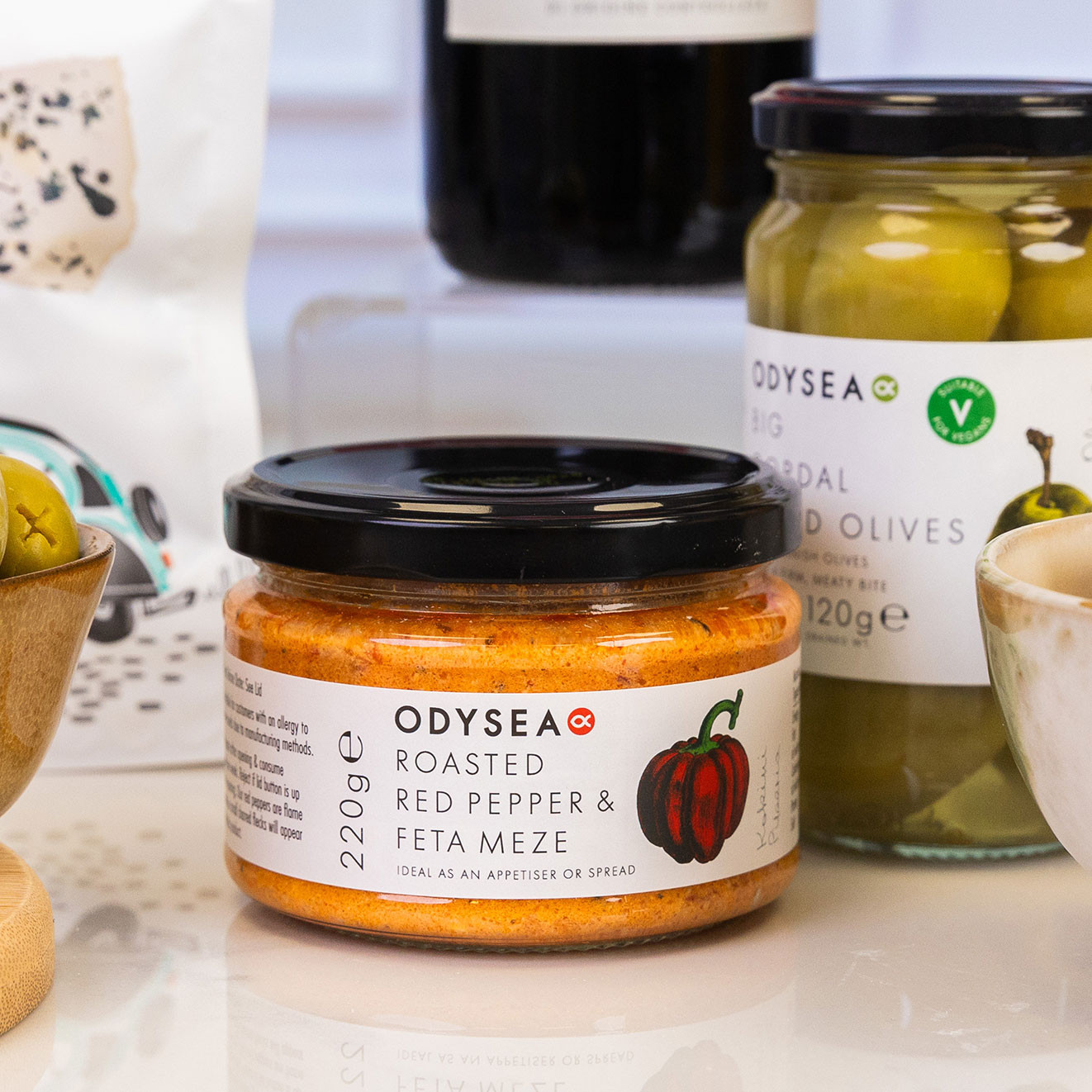 Odysea Roasted Red Pepper & Feta Meze, a creamy Mediterranean-style dip perfect for spreading or serving with crackers and crisps.