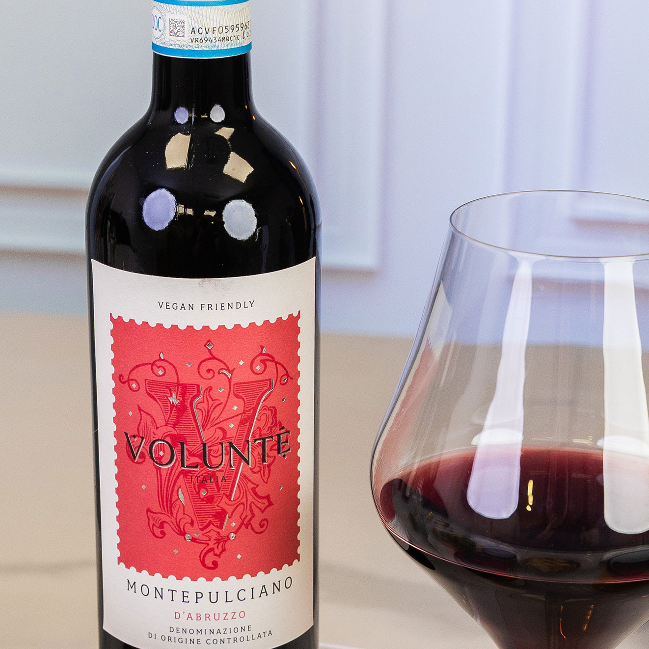 Volunté Montepulciano d'Abruzzo vegan-friendly Italian red wine served alongside a glass of rich red wine.