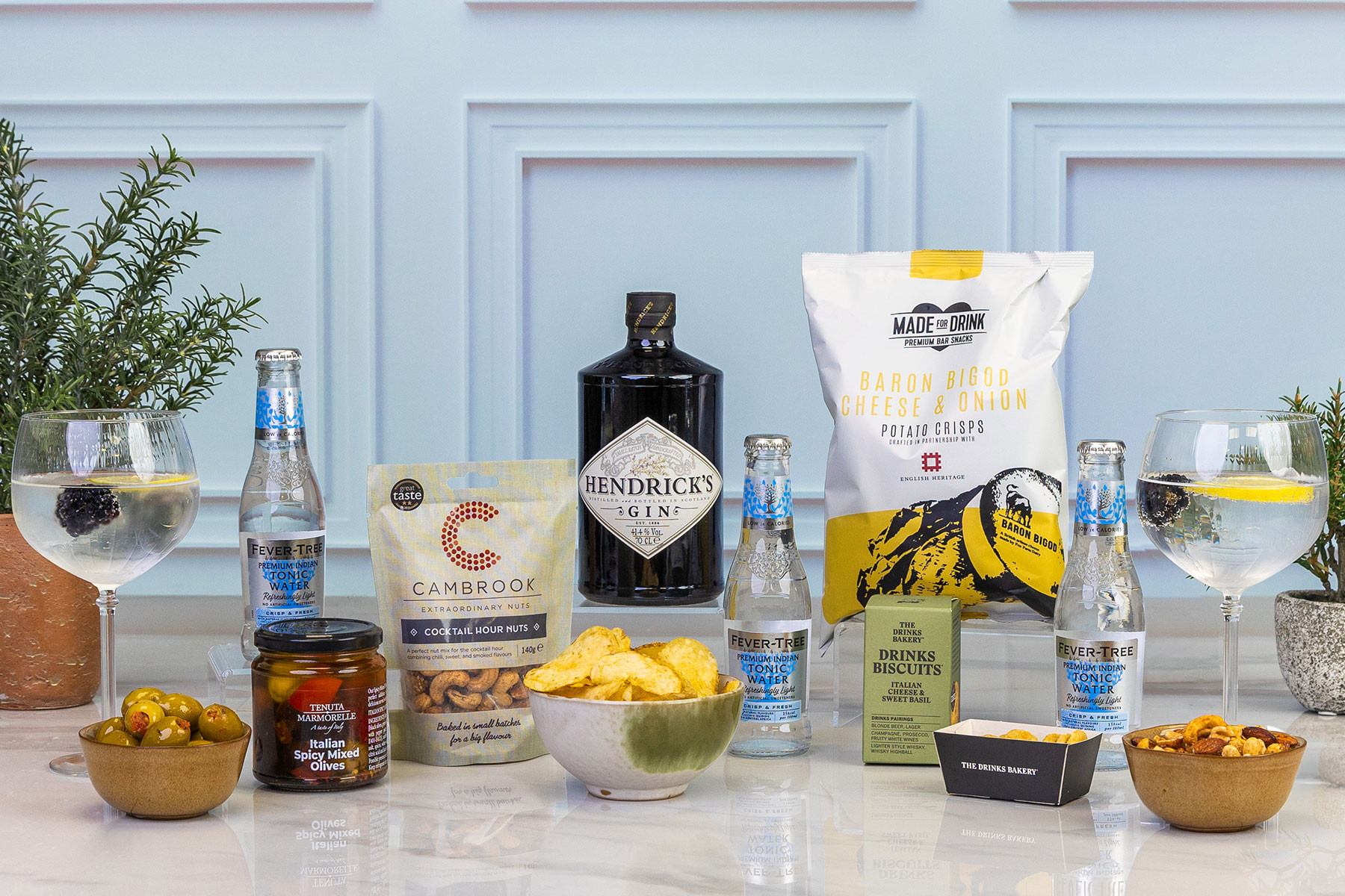 Premium Hendrick's Gin gift set featuring Hendrick's Gin, Fever-Tree light tonic water, cocktail snacks, mixed olives, savoury biscuits and crisps for the perfect gin and tonic experience.