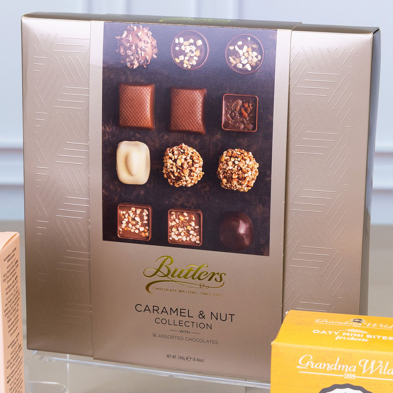 Butlers Caramel & Nut Collection featuring an assortment of premium milk, dark and white chocolates with caramel and nut fillings.