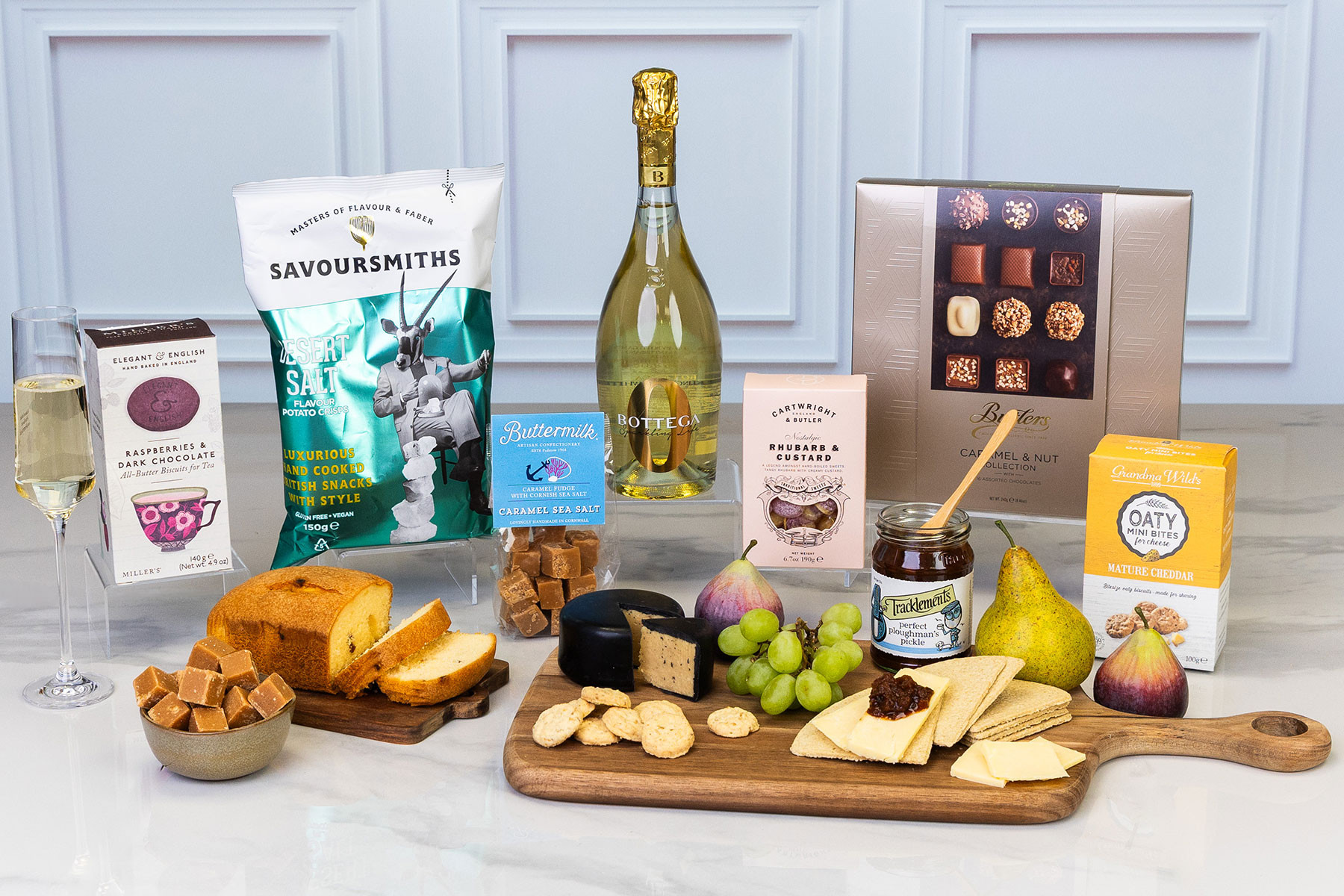 Luxury sparkling wine gift hamper featuring Bottega Sparkling Life, artisan chocolates, savoury snacks, fruit cake, cheese accompaniments and gourmet treats for celebrating special occasions.