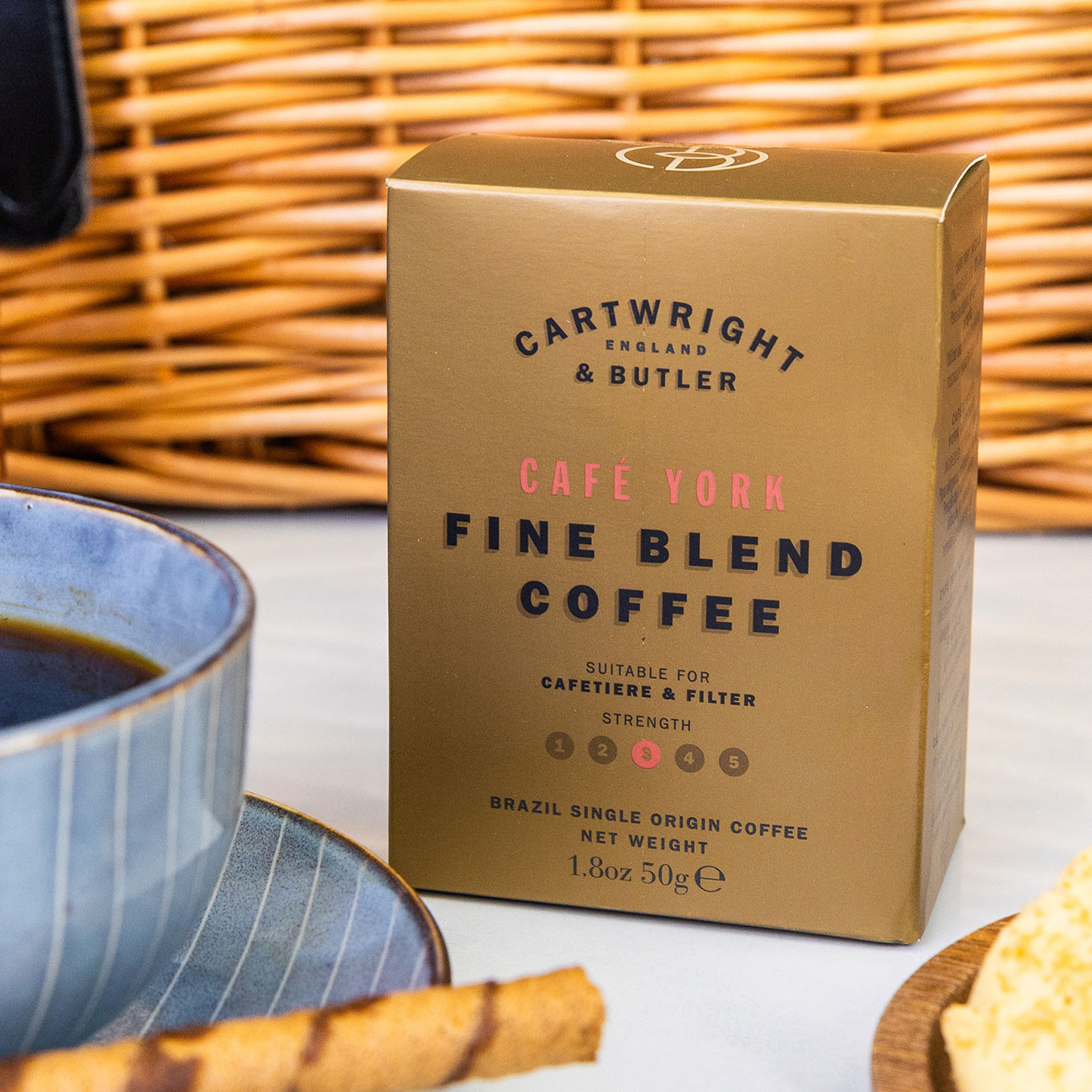 Cartwright & Butler Café York fine blend Brazilian coffee, suitable for cafetière and filter brewing, displayed beside a freshly poured cup of coffee.