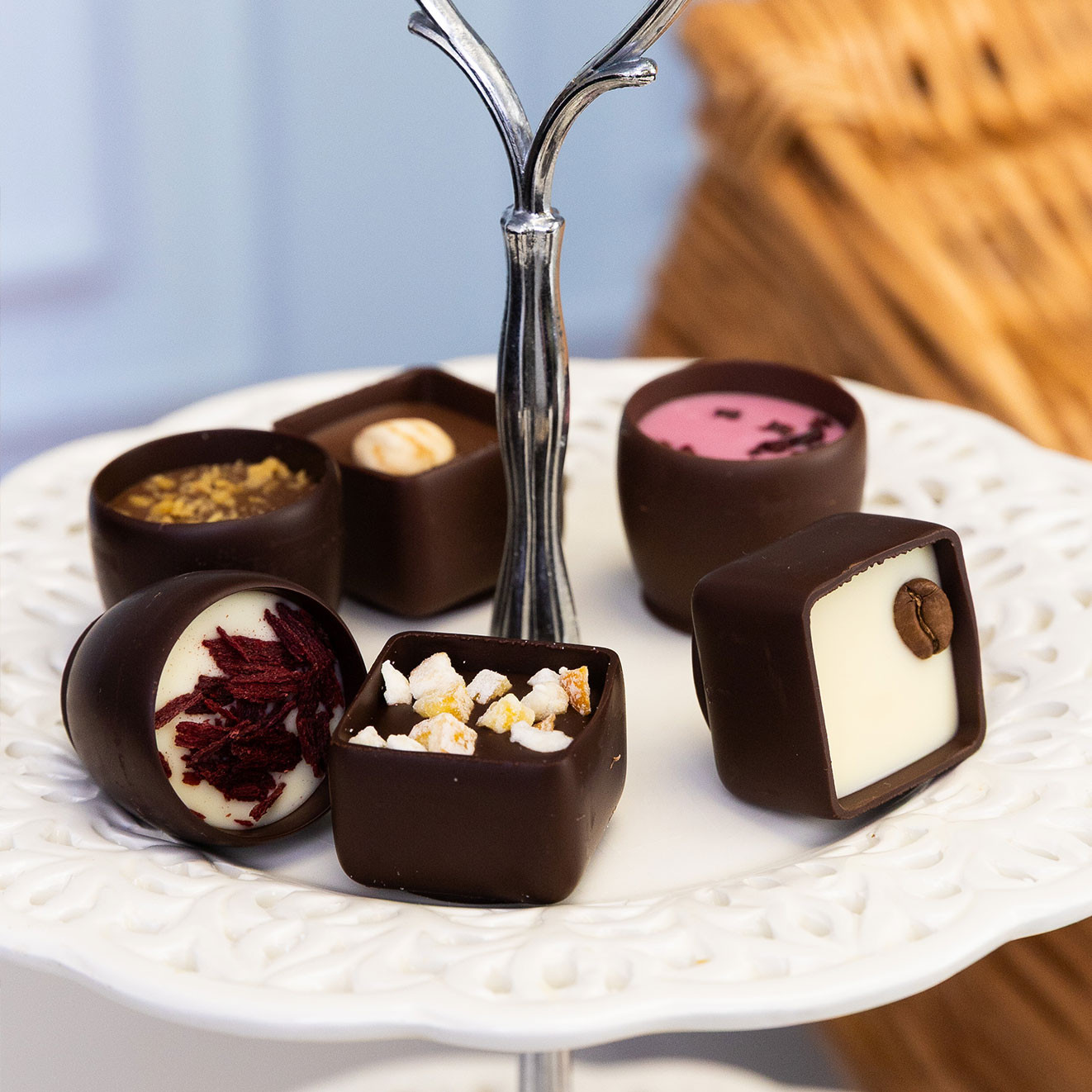 Assortment of Butler's Dessert Menu chocolates featuring rich chocolate shells with indulgent dessert-inspired fillings displayed on a cake stand.