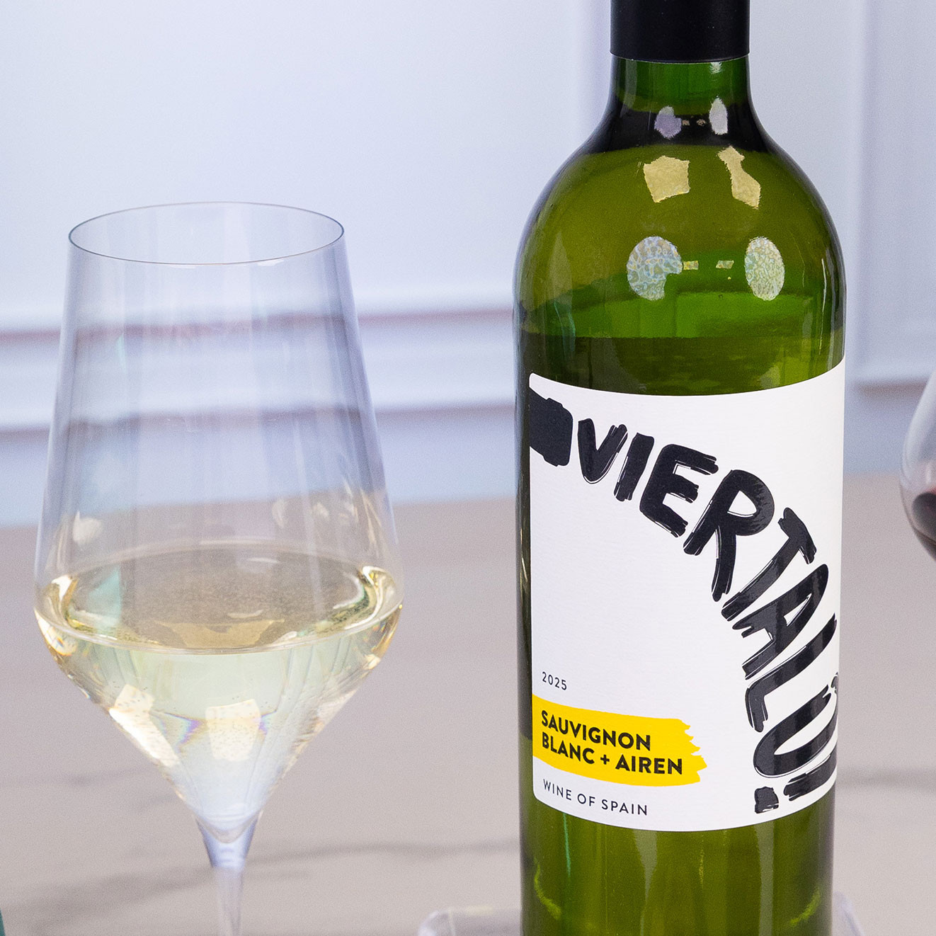 Bottle of Viertalo Sauvignon Blanc and Airén Spanish white wine served with a glass of chilled white wine, perfect for entertaining and celebrations.