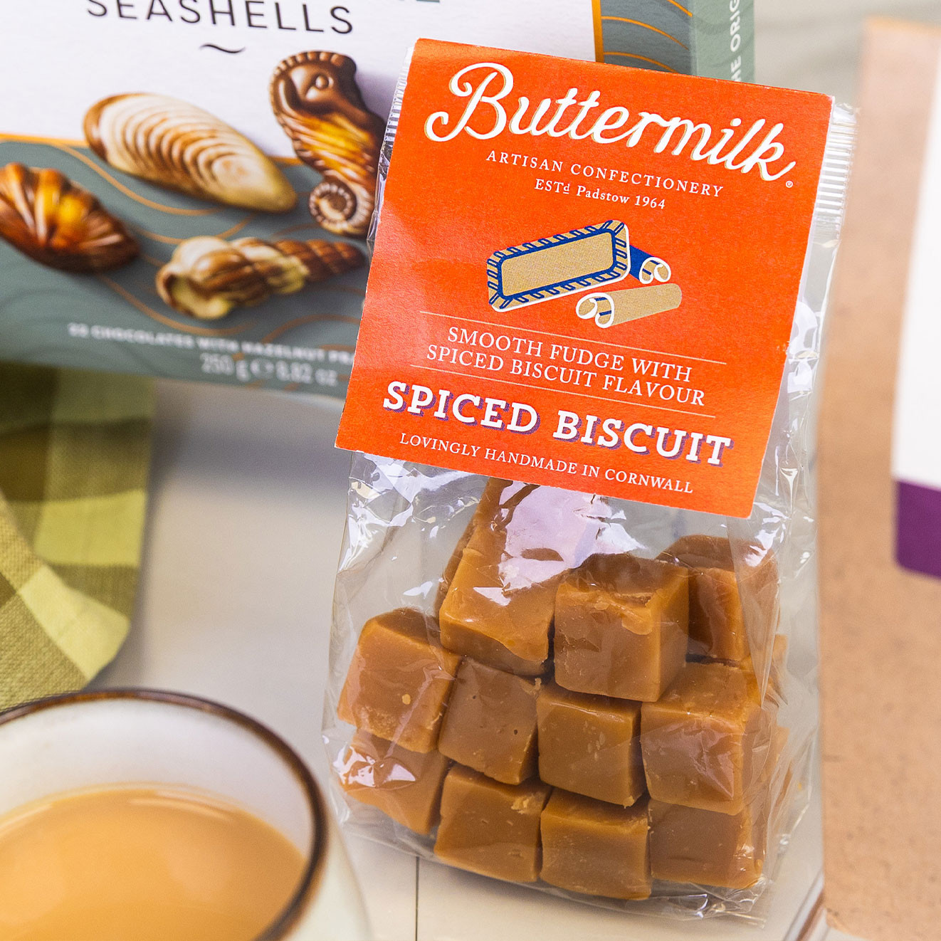 Bag of Buttermilk handmade spiced biscuit fudge with rich caramel-coloured fudge cubes, offering a comforting sweet treat inspired by classic biscuits.