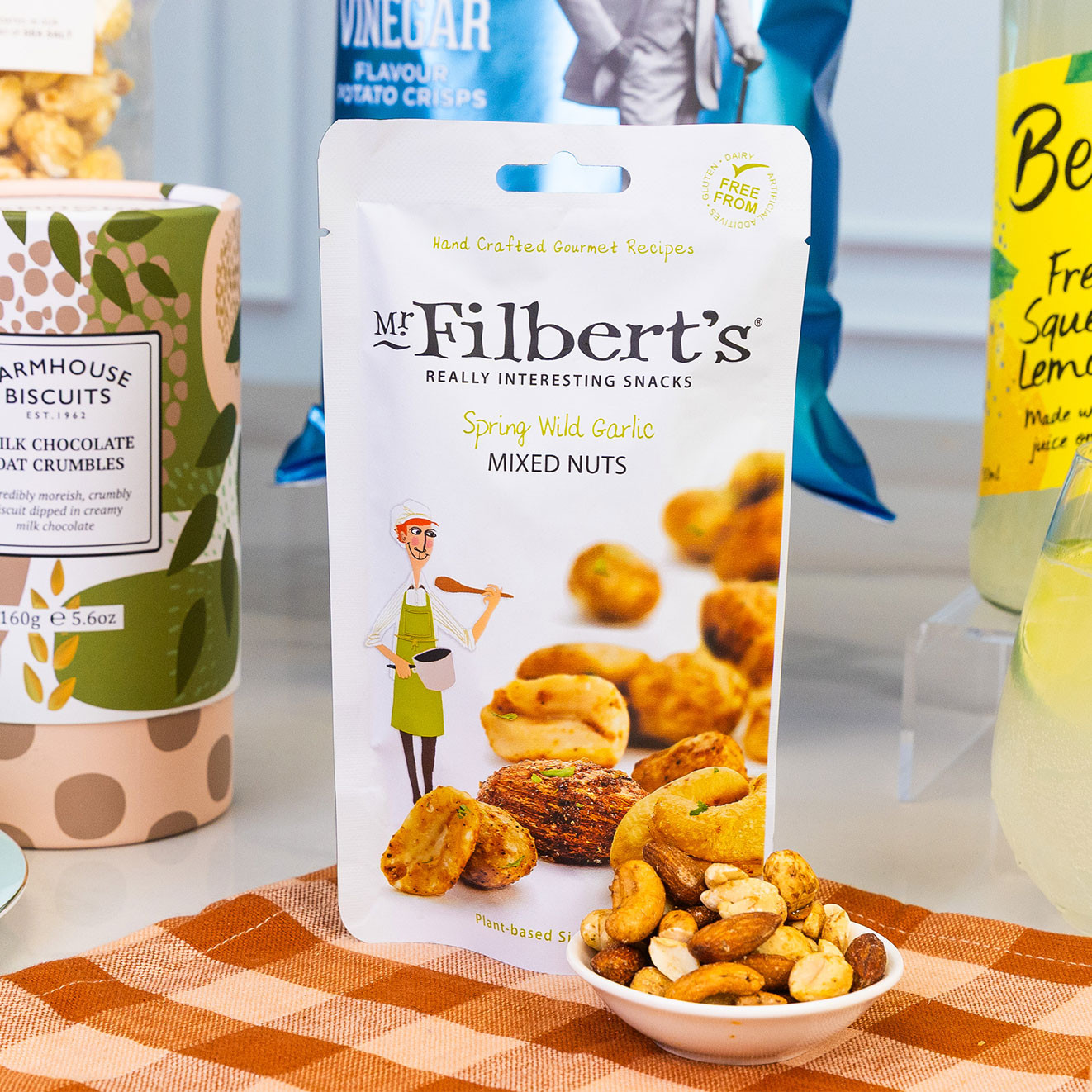 Pack of Mr Filbert's Spring Wild Garlic Mixed Nuts served in a small bowl, combining roasted nuts with a savoury wild garlic seasoning for a flavourful snack.