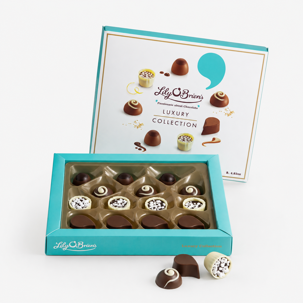 Lily O’Brien’s 137g Luxury Collection, presented in an open turquoise gift box with an assortment of milk, dark and white chocolates, with three chocolates displayed in front.