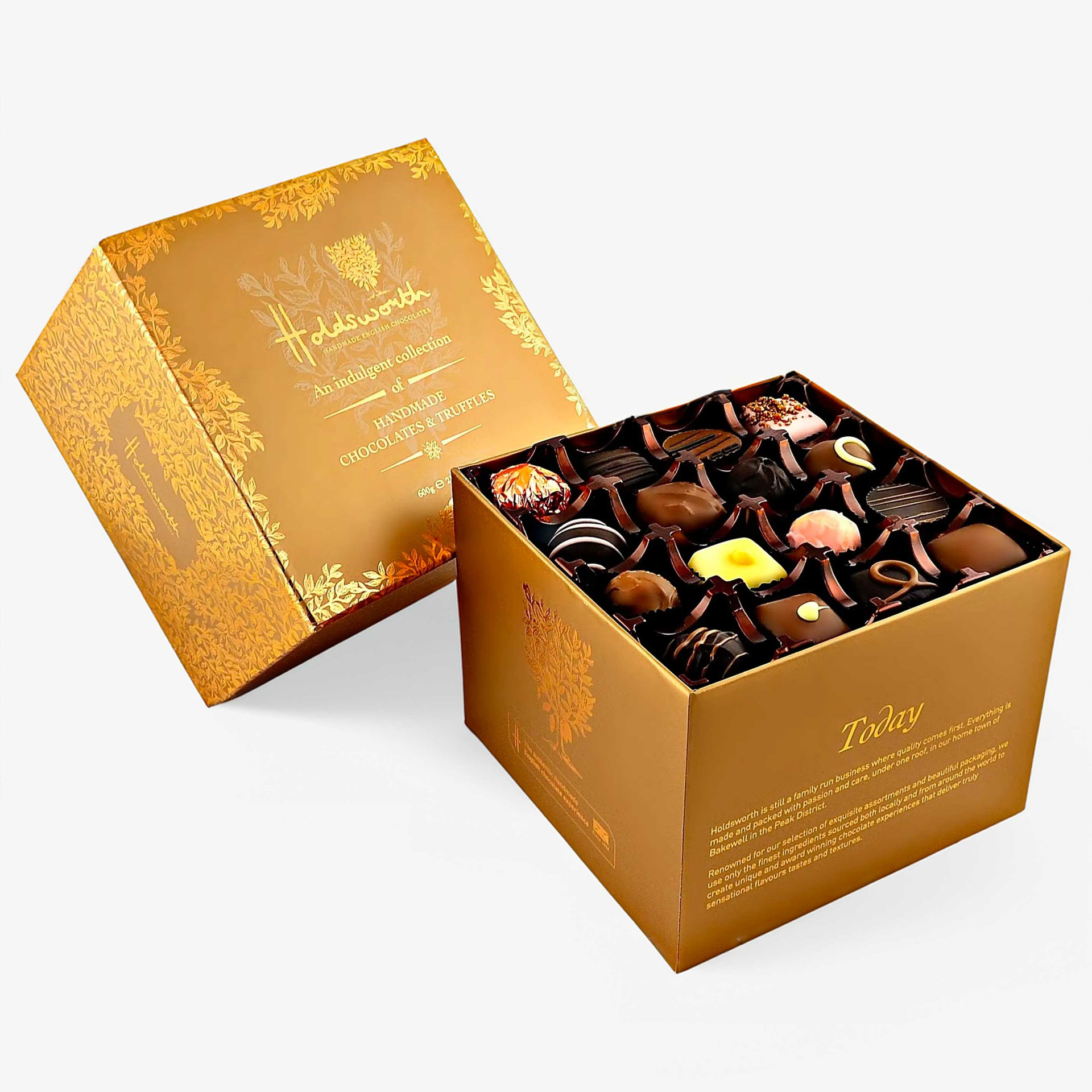 Holdsworth Indulgence Collection gift box containing an assortment of handmade chocolates and truffles in gold packaging.