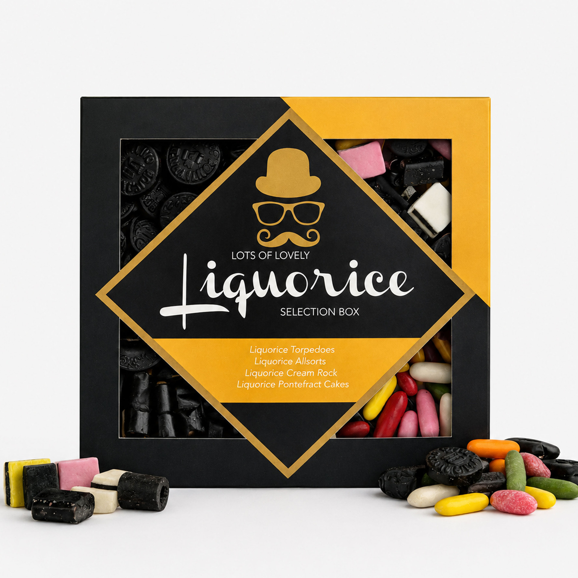 Liquorice selection gift box featuring assorted liquorice torpedoes, allsorts, cream rock and Pontefract cakes, with colourful sweets displayed around the box.