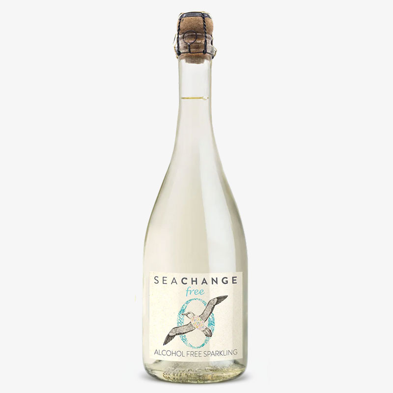 Bottle of Sea Change Free Alcohol-Free Sparkling with a seabird illustration, cork closure, and pale sparkling drink.