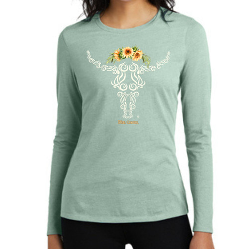Steel Cowgirl sunflower steer skull long sleeve shirt in soft sage green, modeled with jeans for a casual everyday look.