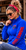 Side view of Steel Cowgirl Shades blue women's jacket featuring red faux embroidered STEEL COWGIRL sleeve lettering.