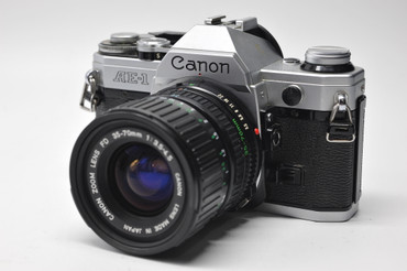 Pre-Owned - Canon AE-1 Chrome w/50mm f1.8 FD/SC lens at Acephoto.net