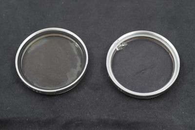 Pre-Owned - AS-IS 2x Leica - filters UVa little crack in one and haze in second filter. Silver E.Leitz Germany.