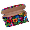 A close-up view of the Folkstar Eyeglass Case featuring a sleek black background adorned with a vibrant floral print inspired by the timeless Lowicz pattern. The metal case has rounded edges and a secure latch closure, making it a stylish and protective accessory for eyeglasses.