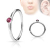 Tiny Crystal Set Side Surgical Steel nose hoop cut ring, silver nose ring with pink crystal embellishment.