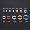SoScene Glitter Bomb Soft Silicone Ultra Thin Ear Gauge Skins, image of various glittery silicone earlobe stretchers in different sizes and colors displayed on a black background.