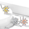 L Bend Nose Stud Rings Double Tiered CZ Starburst Top 316L Surgical Steel 20g, image showing three nose stud rings with starburst design and cubic zirconia stones in gold, silver, and rose gold finishes.