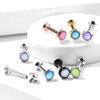 Reflective Stone Medusa Labret Stud Helix Tragus Cartilage 16 Gauge Monroe, set of colorful earrings with reflective stones in Pink, Blue, Purple, Green, black, white and silver colors displayed on a white surface.