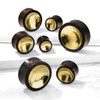 SoScene Organic Sono Wood Saddle Plug with Concave Gold Tin Center on Both Sides, product image showing various sizes of wooden plugs with shiny gold inner parts.