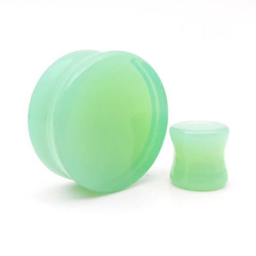 SoScene Mint Green Opalite Glass Ear Plug Gauges, vibrant mint green color, smooth rounded shape and translucent appearance.
