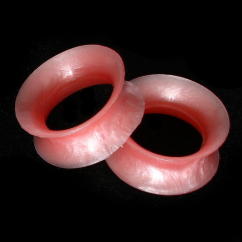 SoScene Pearlescent Peach Ultra thin Ultra Low profile Silicone Ear Skins, two peach-colored silicone ear skins with a glossy finish on a black background.
