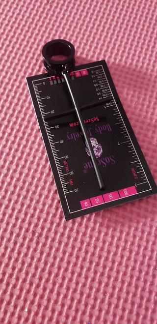 SoScene Gold Large Stainless Steel Dangle Cross Screw Back Ear Plugs, image of a pair of large gold stainless steel dangle cross screw back ear plugs on a pink textured surface with a measurement card underneath.