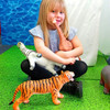Girl playing with our large toy animals