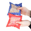 Person holding 2 sensory bags for children