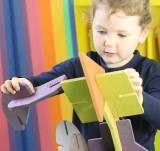 child playing with our U-Nu 140 piece eco-friendly colourful wooden natural building and construction set