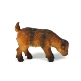 Brown and black toy baby goat figure from a farm animals toy set