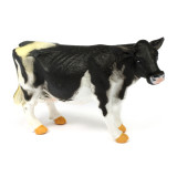 Black and white toy cow figure  from a farm animals toy set