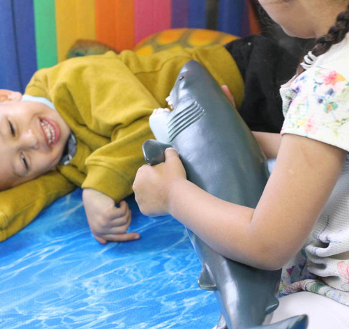 children playing with our jumbo shark toy