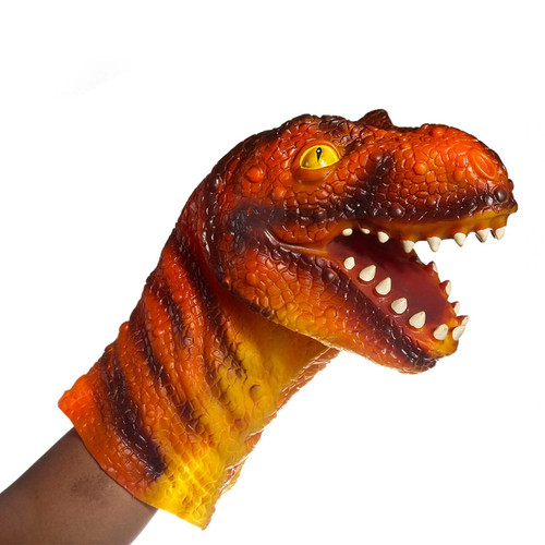 child holding dinosaur hand puppet - 2