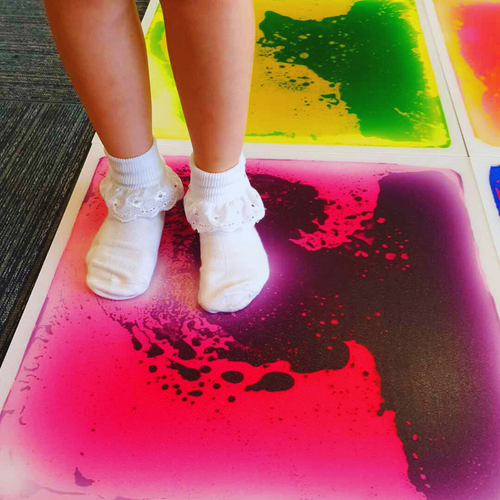 child stood on one of our 6 sensory floor tiles