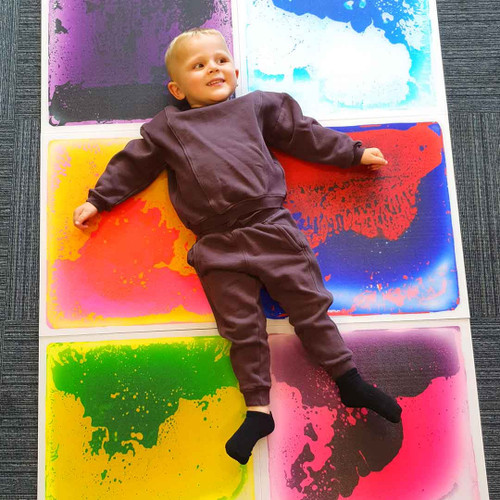 Child playing with our sensory floor tiles