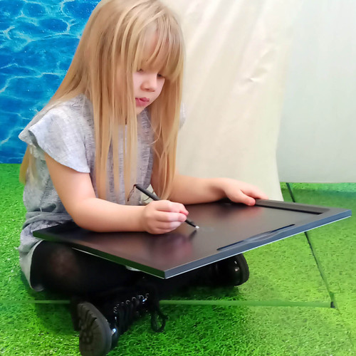 Girl using our Children's LCD Writing Tablets Class Pack - 5 Small + 1 Large -