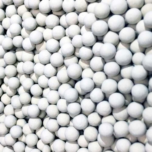 Up close photo of white activated alumina desiccant in 1/8" bead size.