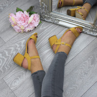 Model wearing Mustard Suede Mid Block Heel Ankle Strap Barely There Sandals