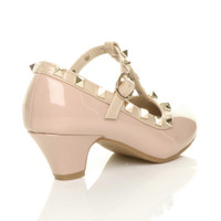 Back right side view of Nude Pink Patent Heeled Studded T-Bar Court Shoes
