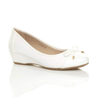 Front right side view of White PU Low Mid Wedge Bow Court Shoes