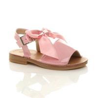 Front right side view of Pink Patent Infants Flat Buckle Ribbon Bow Menorcan Sandals