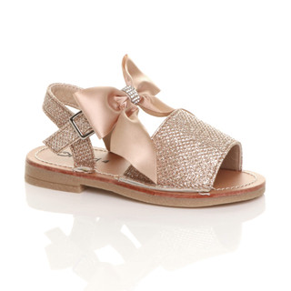 Front right side view of Gold Glitter Infants Flat Buckle Ribbon Bow Menorcan Sandals