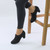 Model wearing Black Suede Mid Heel Buttons Brogue Ankle Boots Booties